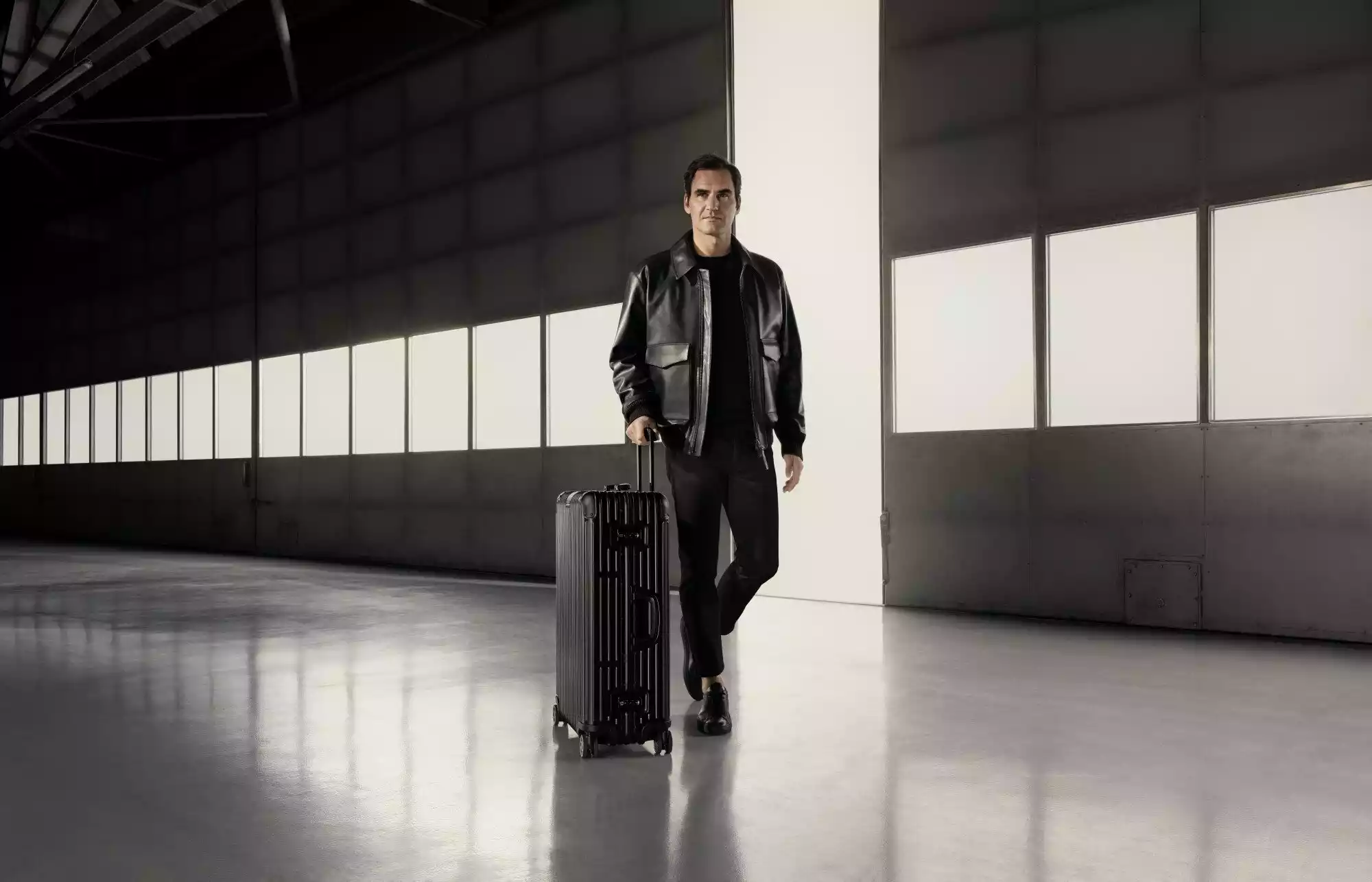 roger-federer-rimowa-endorsement.jpg Roger Federer posing for Rimowa